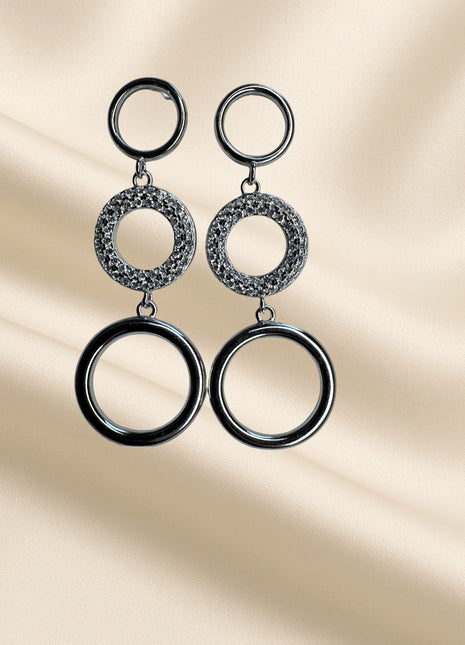 Silver dangling earrings with white zircons