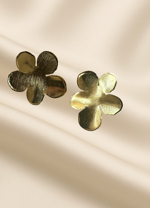 Gold flower-shaped earrings