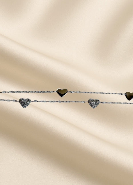 Double silver bracelet with heart motifs