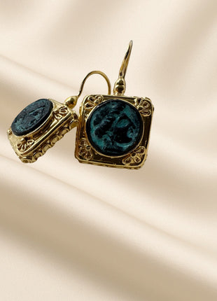 Silver earrings with gold plating and bronze detail in a square frame