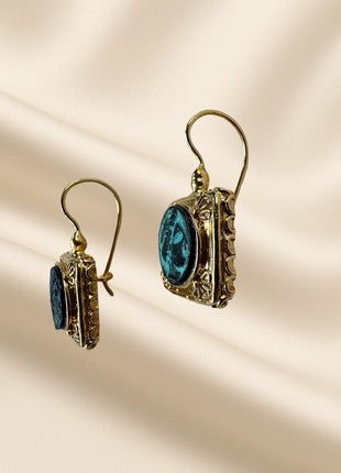 Silver earrings with gold plating and bronze detail in a square frame