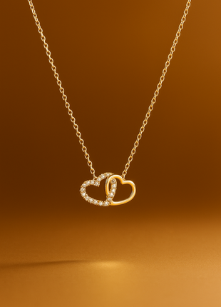 Zlatna ogrlica s dvostrukim srcima i dijamantima