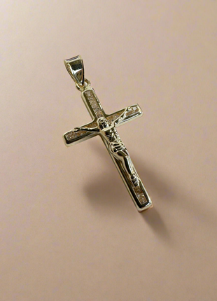 Gold cross with zircons