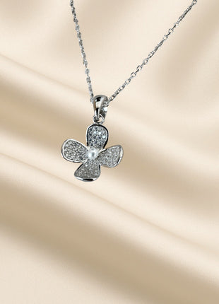 Silver necklace with flower-shaped pendant and zircons