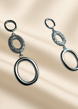 Silver dangle earrings with ovals and white zircons