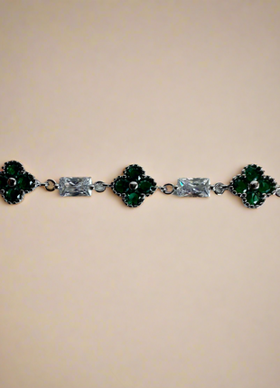 Silver bracelet with clover motif and green zircons