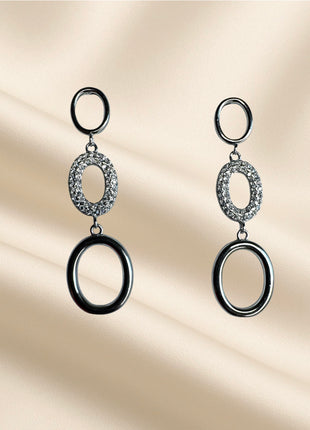 Silver dangle earrings with ovals and white zircons