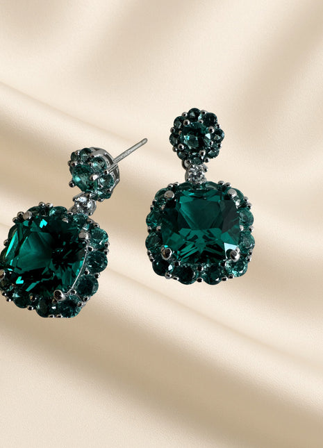 Silver earrings with green crystals