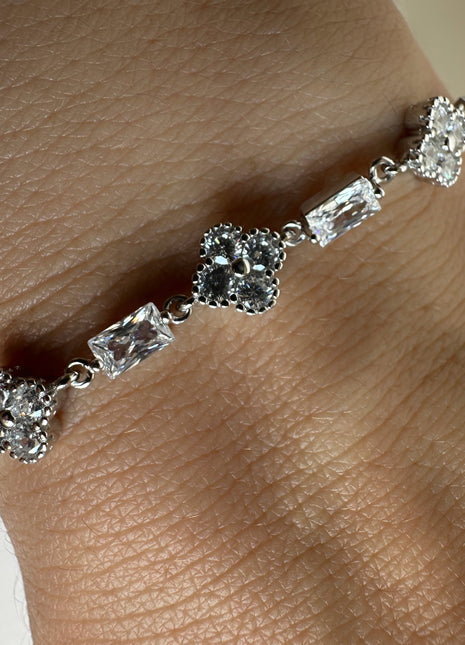 Shiny silver bracelet with flowers and baguette zircons