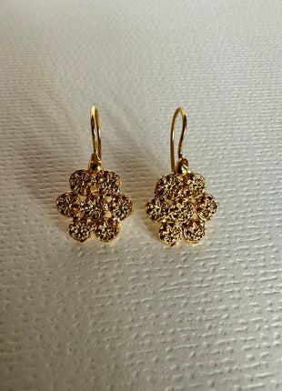 Silver earrings with gold plating in the shape of a flower