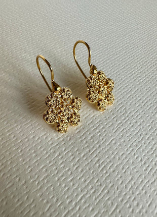 Silver earrings with gold plating in the shape of a flower